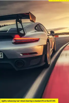  ??  ?? Agility-enhancing rear-wheel steering is standard fit on the GT2 RS