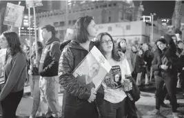  ?? MAYA ALLERUZZO AP ?? Women listen to a speaker during a weekly rally calling for the release of hostages who were kidnapped on Oct. 7, 2023, in Tel Aviv, Israel, Saturday.