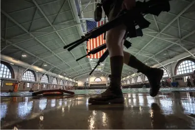  ?? The Associated Press ?? A group of U.S. Marine Corps recruits marches back into formation at the Marine Corps Recruit Depot pool during integrated swim training on June 28 in Parris Island, S.C.