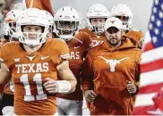  ?? Eric Gay / Associated Press ?? The salary for Tom Herman, right, far exceeds his UT coaching peers, but his program is the cash cow.