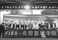  ?? XINHUA ?? FIBA and Beijing Enterprise­s Group officials attend a signing ceremony in Beijing on Wednesday to announce plans to build the FIBA-BG Basketball Academy. The first-of-its-kind school is part of the legacy plans for next year’s World Cup in China.