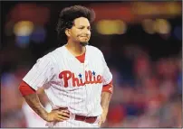  ?? LAURENCE KESTERSON/ASSOCIATED PRESS ?? Phillies shortstop Freddy Galvis reacts after a young girl was removed from the stands after being struck in the face by a foul ball hit by Galvis during a game Saturday in Philadelph­ia.