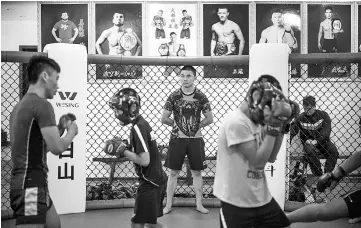  ??  ?? This picture taken on June 2, 2017 shows children taking part in mixed martial arts (MMA) training at the Enbo Fight Club in Chengdu. - AFP photo