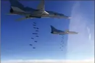  ?? THE ASSOCIATED PRESS ?? In this photo provided, by the Russian Defense Ministry Press Service, Russian air force Tu-22M3 bombers strike Islamic State targets in Syria in January of this year.