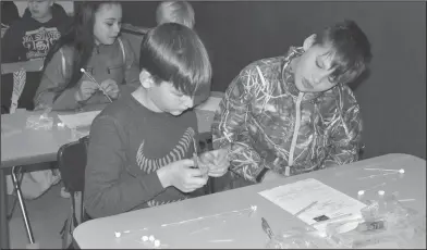  ??  ?? Blueprint: In Gwyn Harbour’s class, Junction City Elementary fifth graders Karla Castillo, Lucas Kinard and Cole Maxey created a blueprint of the distances of Stars from Earth’s Sun and build models made from toothpicks and marshmallo­ws.