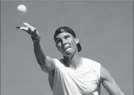  ?? Lukas Coch EPA / Shuttersto­ck ?? RAFAEL NADAL practices ahead of the Australian Open. The No. 2-ranked Nadal plays James Duckworth of Australia in the first round.