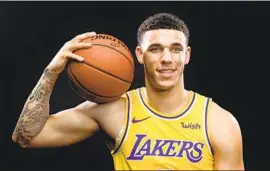  ?? Wally Skalij Los Angeles Times ?? LONZO BALL, showing off some tattoos last year, recently got a sleeve of them on his left arm, including the likenesses of Jackie Robinson and Malcolm X.