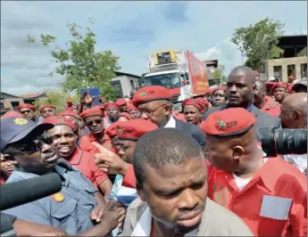  ??  ?? ADVERSARIA­L: EFF leader Julius Malema confronts a policeman minutes before submitting his party’s candidates list for the May elections.