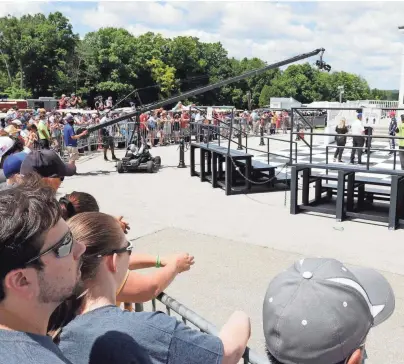  ?? GARY C. KLEIN / USA TODAY NETWORK-WISCONSIN ?? Fans get as close as they can to Felix Rosenqvist’s victory celebratio­n after the second round of the REV Group Grand Prix on Sunday at Road America.