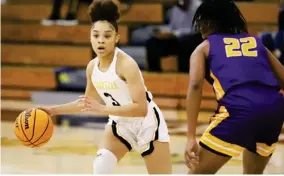  ??  ?? Starkville point guard Jada Odneal (3) dribbles away from the defensive pressure of Columbus on Friday night. (Photo by Jeremy Miller, for Starkville Daily News)