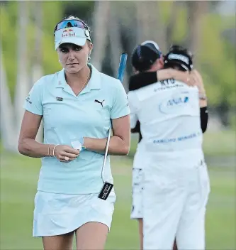  ?? JEFF GROSS GETTY IMAGES ?? One year ago: Lexi Thompson walks off the 18th green as So Yeon Ryu of the Republic of Korea celebrates with her caddie after Ryu defeated Thompson in a playoff during the final round of the ANA Inspiratio­n.