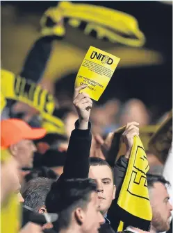  ?? Picture: SNS. ?? United fans protest against chairman Stephen Thompson at a game at Tannadice in March last year.