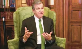  ?? HANNAH SCHOENBAUM/AP ?? Gov. Roy Cooper ended North Carolina’s COVID-19 state of emergency in August — 29 months after it began.