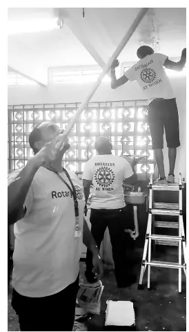  ??  ?? RCNK members seen painting the kitchen at Nannyville Basic School in St Andrew.