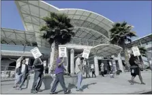  ?? JEFF CHIU ASSOCIATED PRESS ?? Bay Area Rapid Transit workers picket outside a station in Millbrae, Calif., on Monday. Two of San Francisco BART’s largest unions went on strike Monday after weekend talks failed.