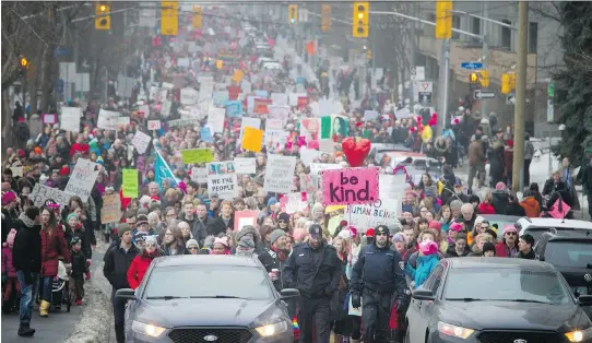  ?? PHOTOS: ASHLEY FRASER ?? Thousands of peaceful demonstrat­ors march down Laurier Avenue on Saturday in support of the Women’s March on Washington and sister organizati­ons around the world, walking from the Human Rights Monument to the Bronson Centre. Police estimated the crowd...