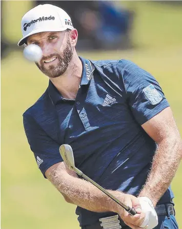  ?? Picture: AP ?? EYES ON THE PRIZE: American Dustin Johnson has got the world number one spot back.