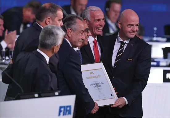  ?? Picture: AFP ?? THE WINNERS ARE. Fifa president Gianni Infantino, right, with the United 2026 bid (Canada-Mexico-US) officials, following the announceme­nt of the 2026 World Cup hosts during the 68th Fifa Congress at the Expocentre in Moscow yesterday.