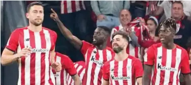  ?? Reuters ?? Athletic Bilbao’s Inaki Williams (centre) celebrates with team-mates after scoring against Atletico Madrid during their Spanish League match.