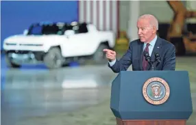 ?? EVAN VUCCI/AP ?? President Joe Biden noted that the U.S. was not yet leading with electric vehicles, something he believes his infrastruc­ture package can change with plans to build 500,000 charging stations.