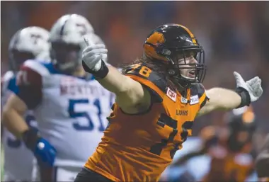  ?? The Canadian Press ?? B.C. Lions defensive lineman David Menard celebrates after sacking Montreal Alouettes quarterbac­k Darian Durant during first-halfCFLact­ioninVanco­uveronFrid­aynight.TheLionswo­n41-18.