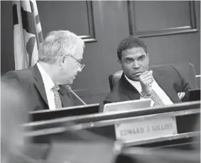  ?? LLOYD FOX/BALTIMORE SUN ?? Board president Edward Gilliss talks with Dallas Dance before Tuesday’s meeting of the Board of Education of Baltimore County.