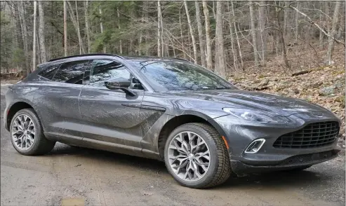  ?? MARC GRASSO PHOTOS / BOSTON HERALD ?? GOING GRAND: The new Aston Martin DBX is an SUV to dream about, with top-of-the-line comfort, power and style. With 542 horsepower from a V8 4.0-liter twin-turbo engine, the Aston Martin DBX is entering the SUV field with a bang, going from zero to 60 in just over 4 seconds and emanating a certain panache.