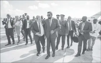  ?? ?? Prime Minister of St Vincent and the Grenadines, Ralph Gonsalves (left in foreground) greeting President Irfaan Ali after his arrival at Argyle on December 14. (Office of the President photo)