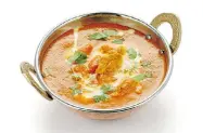  ?? UCKYO/ FOTOLIA.COM ?? Butter chicken, a particular favourite, is considered, along with perogies and sushi, to be an honourary Canadian dish by survey participan­ts.