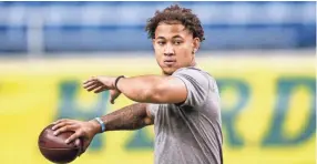  ?? ANDY CLAYTON-KING/AP ?? North Dakota State quarterbac­k Trey Lance throws at the school’s pro day on March 12 in Fargo, N.D. Lance is expected to be one of the first two players drafted from non-football Bowl Subdivisio­n programs.