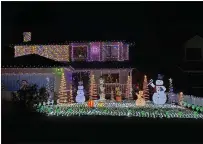  ?? MARY BULLWINKEL — FOR THE TIMESSTAND­ARD ?? A holiday dazzle decorating contest is underway in Fortuna and both residences and businesses are eligible to compete. Pictured is one entry in the residentia­l category from Brandi Lane in Fortuna.