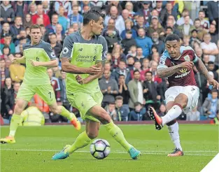  ??  ?? Andre Gray fires Burnley into a two-goal lead.