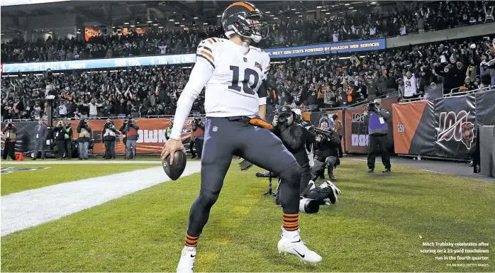  ?? DYLAN BUELL/GETTY IMAGES ?? Mitch Trubisky celebrates after scoring on a 23-yard touchdown run in the fourth quarter.