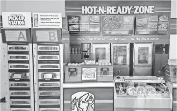  ?? PHOTO COURTESY OF LITTLE CAESARS PIZZA ?? Little Caesars’ Pizza Portal is another example of how customers can skip the line and small talk.
