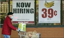  ?? TONY DEJAK — THE ASSOCIATED PRESS FILE ?? A shopper leaves a Marc’s Store in Mayfield Heights, Ohio. With viral cases declining, consumers spending again and more businesses easing restrictio­ns, America’s employers are looking for workers.