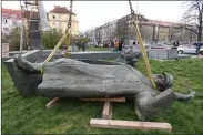  ??  ?? Taking down Marshal Konev’s statue