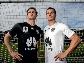  ?? PHILLIP ROLLO/STUFF ?? Wellington Phoenix players Alex Rufer and Steven Taylor model the club’s new FFA Cup kit.