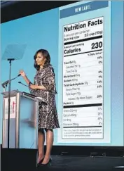  ?? Jacquelyn Martin Associated Press ?? FORMER First Lady Michelle Obama unveils updated food labels at a Washington summit last year.