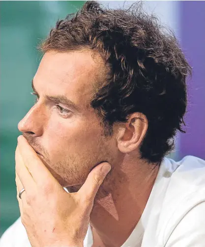  ?? PA. ?? A disappoint­ed Andy Murray faces the media after his Wimbledon exit at the hands of Sam Querrey.