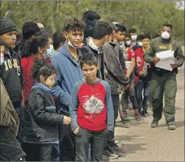  ?? Carolyn Cole Los Angeles Times ?? BORDER PATROL detains migrants in Texas in March. President Biden and Mexico’s Andrés Manuel López Obrador will discuss migration and other issues.
