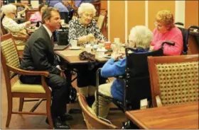  ?? TAWANA ROBERTS — THE NEWS-HERALD ?? Wickliffe Schools Superinten­dent Joseph Spiccia interacts with residents at Atria Newell Creek senior living community in Mentor for the Better Together event on Jan. 11.