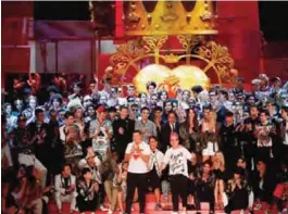  ??  ?? Italian fashion designers Stefano Gabbana, left, and Domenico Dolce acknowledg­e the applause at the end of Dolce&Gabbana’s men’s Spring-Summer 2018 collection.