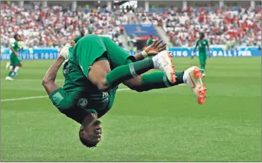 ?? / AP-Darko Vojinovic ?? Saudi Arabia’s Salem Aldawsari celebrates with a flip after scoring his side’s second goal during the group A match between Saudi Arabia and Egypt at the 2018 soccer World Cup at the Volgograd Arena in Volgograd, Russia.