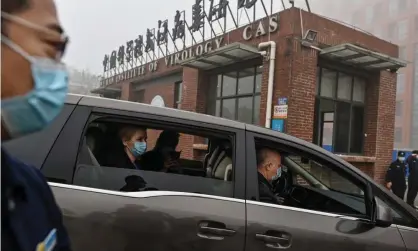  ?? Photograph: Héctor Retamal/ AFP/Getty ?? A WHO team investigat­ing the origins of Covid-19 arrive at the Wuhan Institute of Virology in February 2021.