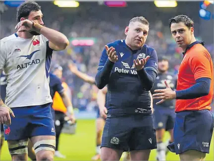  ?? Picture: PLANET RUGBY ?? Scotland fly-half Finn Russell (middle) speaks to assistant referee Nika Amashukeli.