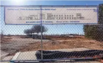  ?? GABRIELA CAMPOS/THE NEW MEXICAN ?? A sign Wednesday outside the constructi­on site for the new Milagro Middle School campus says ‘Coming soon!’ Work on the new school is expected to take longer because of constructi­on changes.