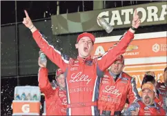  ?? Terry Renna / The Associated Press ?? Ryan Reed celebrates in Victory Lane after winning Saturday’s Xfinity series race at Daytona Internatio­nal Speedway in Daytona Beach, Fla.