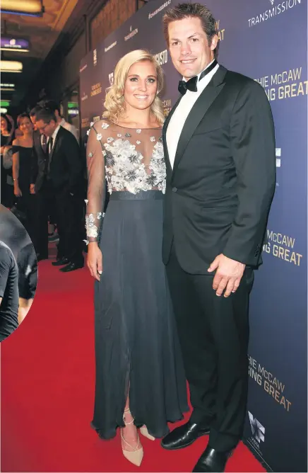  ??  ?? Richie McCaw with his fiancee Gemma Flynn at the Chasing Great film premiere in Auckland and ( inset) sharing a handshake with former Australian rival George Gregan at Eden Park.