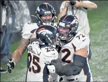  ?? Andy Cross / The Denver Post ?? Broncos left tackle Garett Bolles, right, celebrates with running back Melvin Gordon, left, and guard Dalton Risner during a game against the Jets on Thursday at Metlife Stadium in East Rutherford, N.J.
