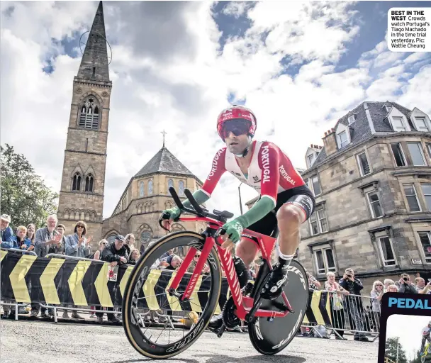  ??  ?? BEST IN THE WEST Crowds watch Portugal’s Tiago Machado in the time trial yesterday. Pic: Wattie Cheung